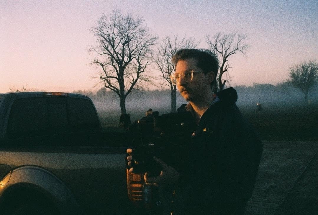 Devin holding a camera